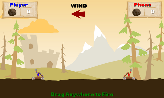 Catapult Wars gameplay with two catapults, a mountain backdrop and a wind indicator.
