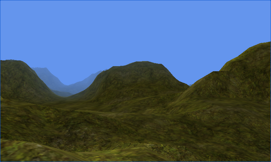 A textured, lit mountain valley beneath a clear blue sky; the sun glow and lens flares are absent.