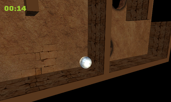 Marble Maze gameplay with the marble rolling through a tilted stone maze.