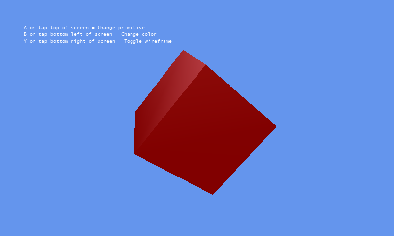 A dark red three-dimensional cube on a blue background, with the on-screen control hints.